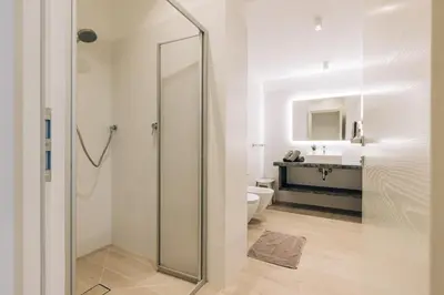 a bathroom with a shower with a toilet and a sink at Residence Martinelli in Laives