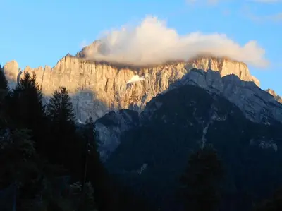 a view of a mountain with a cloud above it at Mountain in Alleghe
