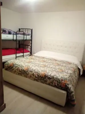 a bedroom with two bunk beds in a room at Mountain in Alleghe