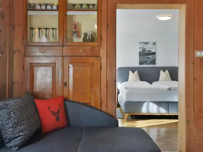 a bedroom with two white beds and a wooden cabinet at Apartment Luca by Interhome in Ortisei