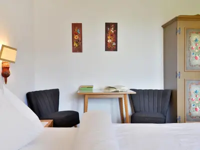a bathroom with a toilet and a sink and a window at Apartment Illyria by Interhome in Ortisei