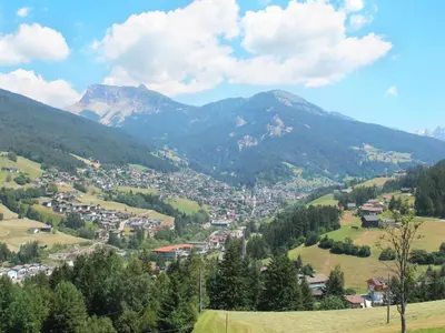 a town in a valley with mountains in the background at Apartment Illyria by Interhome in Ortisei
