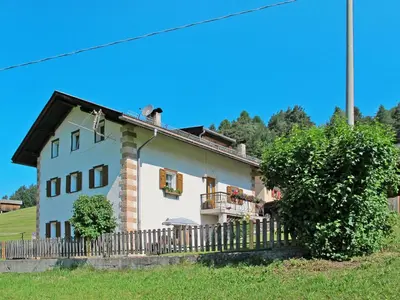 a white house with a fence in front of it at Apartment Mastle by Interhome in Ortisei