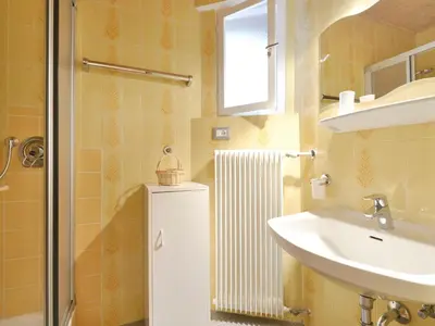 a small bathroom with a sink and a mirror at Apartment Mastle by Interhome in Ortisei