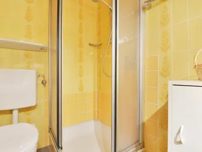 a bathroom with a shower with a toilet and a sink at Apartment Mastle by Interhome in Ortisei
