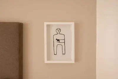 a picture of a man on a wall at Hotel Schwarzschmied, a Member of Design Hotels in Lana