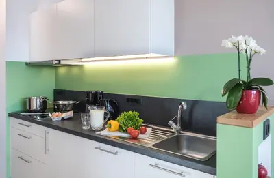 a kitchen counter with fruits and vegetables on a cutting board at Putzerhof in Siusi