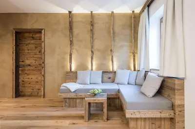 a living room with a couch and a table at Kräutererbe Bacherhof in Nalles