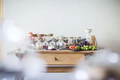 a table with a bunch of fruit on it at Kräutererbe Bacherhof in Nalles