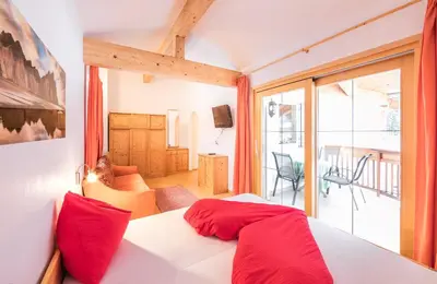 a man riding a bike down a hill at Hotel Appartement Haus Gitschberg in Vandoies
