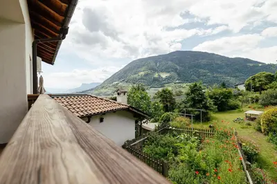a balcony with a view of a mountain at Hofer am Bach in Lagundo