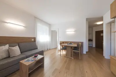 a living room with a couch and a table at Vettererhof in Lana