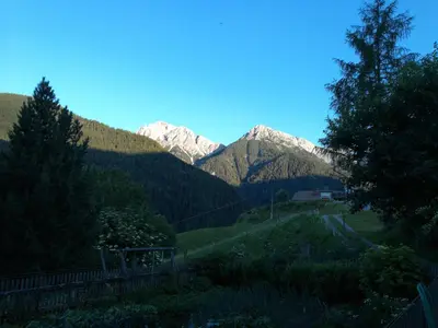 a view of a mountain range with snow covered mountains at Bigraberhof in Valdaora