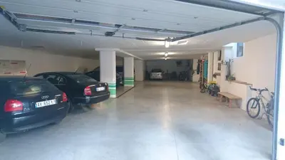 a garage with two cars parked in it at Apartments Blumenheim in Castelrotto