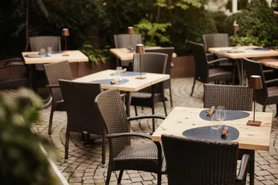a row of tables and chairs at a restaurant at Corso am Graben in Brunico