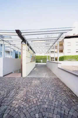 an empty building with a brick walkway at Villa Floris in Bressanone
