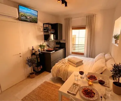 a bedroom with a large bed and a window at Centro Storico di Merano in Merano