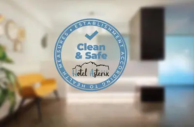 a sign that says clean and safe in a room at Hotel Asterix in Bolzano
