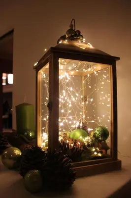 a lantern filled with christmas lights on a table at Hotel Millanderhof in Bressanone