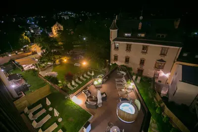 a group of chairs sitting in a waiting room at Dominik Alpine City Wellness Hotel - Adults only in Bressanone