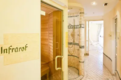 a door to a bathroom with a shower at Hotel Mondschein in Vipiteno