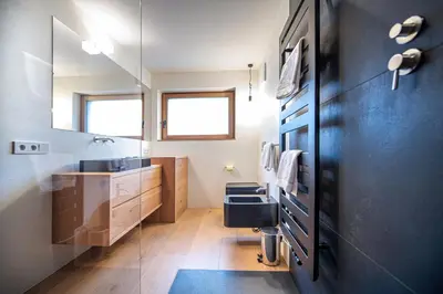 a bathroom with a sink and a toilet at Villa Mayr in Ortisei