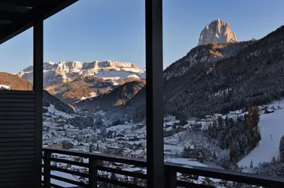 a view of a snowy mountain from a window at Villa Mayr in Ortisei