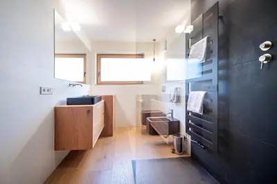 a bathroom with a sink and a mirror at Villa Mayr in Ortisei
