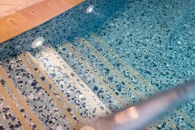 a close up of a pool with water on the floor at DAS BADL - Smart Retreat AO in Caldaro
