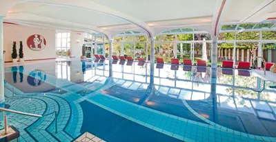 a pool in a hotel with a swimming pool at Seegarten in Caldaro