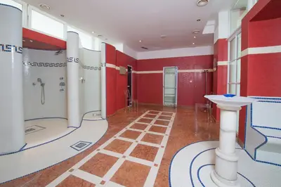 a large bathroom with a shower and a sink at Seegarten in Caldaro