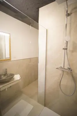a bathroom with a shower and a sink at Gstattlhof Mountain Farmhouse in Braies