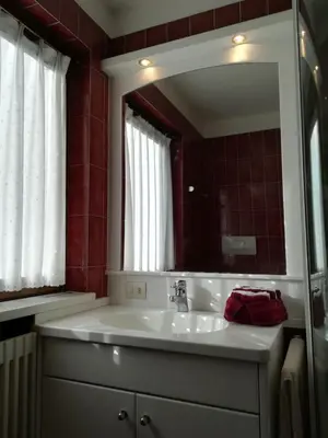 a bathroom with a sink and a mirror at Dreaming Ortisei in Ortisei
