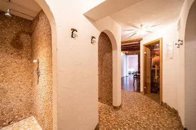 a hallway in a house with a tile floor at Hohe Gaisl in Braies