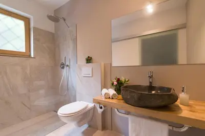 a bathroom with a sink and a toilet at Pension Sonnheim in Gargazzone