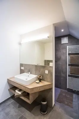a bathroom with a sink and a mirror at Residence Rösch in Merano