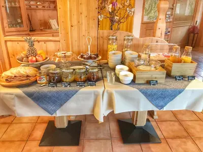 a table filled with food and other food items at Eco-Baita Natura Spensierata in Canale San Bovo