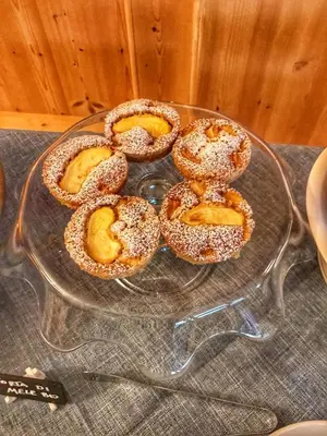 a glass plate with some bagels on a table at Eco-Baita Natura Spensierata in Canale San Bovo