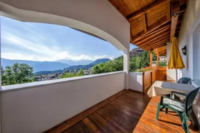 a balcony with a view of the mountains at Residence Rossboden mit Hallenbad in Verano