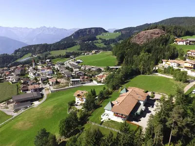 an aerial view of a small village in the mountains at Residence Rossboden mit Hallenbad in Verano