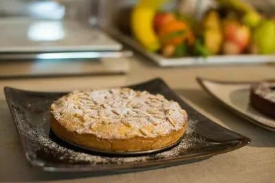 a cake sitting on a plate on a table at Maso Franceschella in Carano