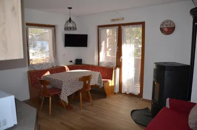 a kitchen with a sink and a microwave at Casa del bosco in Canazei