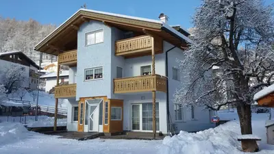 a house in the winter with snow on the ground at Alla Fontana Termale in Carano