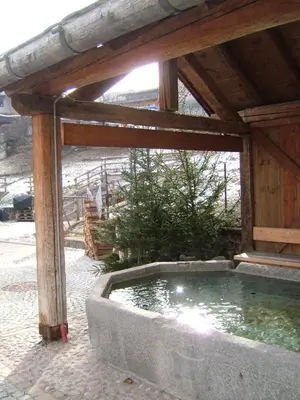 a large pool of water in a building at Alla Fontana Termale in Carano