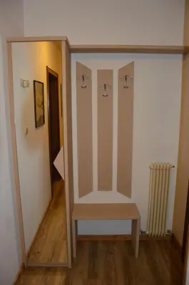 a room with a closet with a bench in it at Cèsa Soracrepa in Canazei
