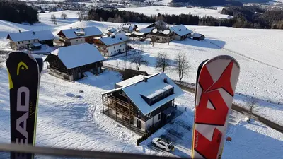 an aerial view of a house in the snow with a snowboard at KRONPLATZ CHALET WALCHHORN - Brunico, Dolomites in Brunico