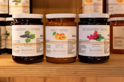 four jars of jam sitting on a shelf at Bacherhof in Val di Vizze