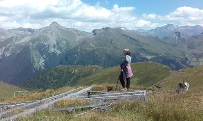 a woman standing on the top of a mountain at Bacherhof in Val di Vizze