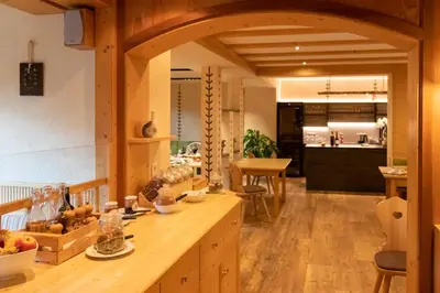 a kitchen with a wooden counter top in a room at Bacherhof in Val di Vizze