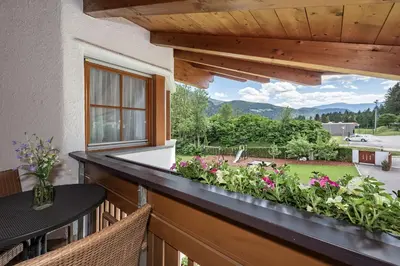 a balcony with a view of a garden at Appartements Bäckhof in Villa Ottone
